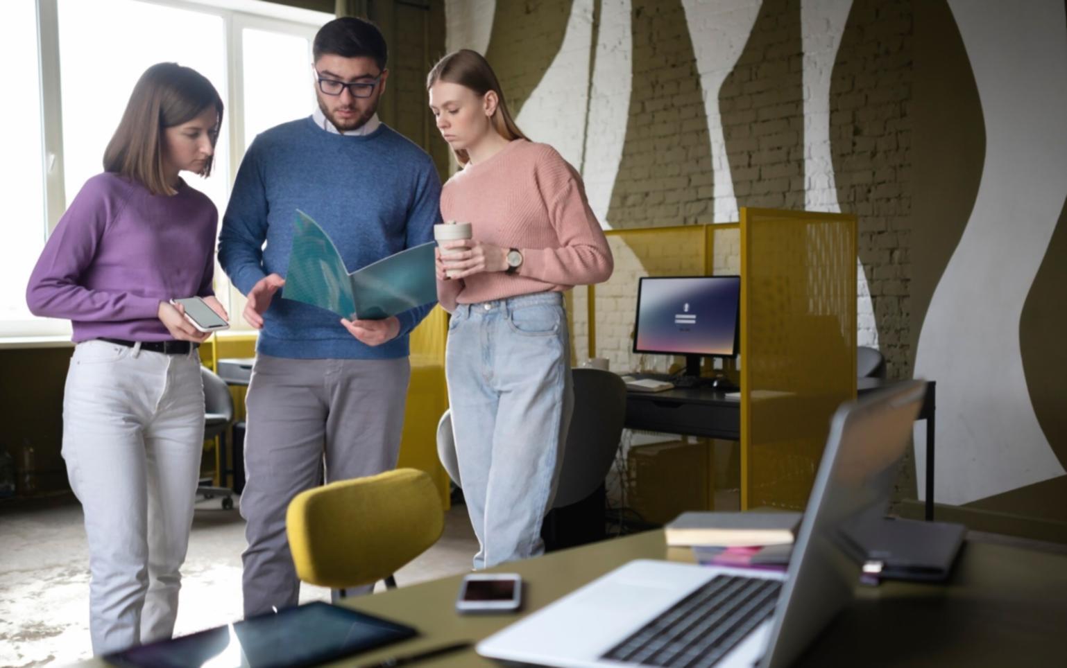 Students collaborating on financial planning exercises in modern classroom setting